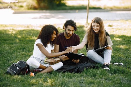 Students sitting together on grass