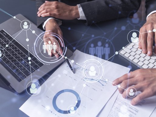 man and woman analyzing the market of alumni