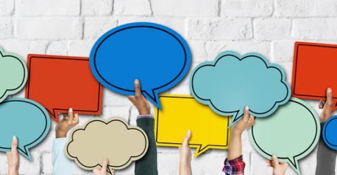 several arms holding up speech bubbles