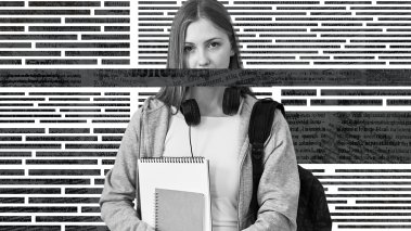 Student holding notebooks standing in front of newspaper background. A stripe of text covers her mouth.