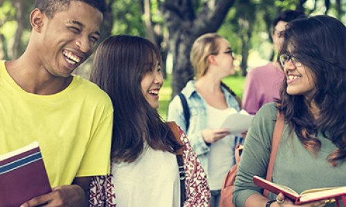 students walking on a college campus